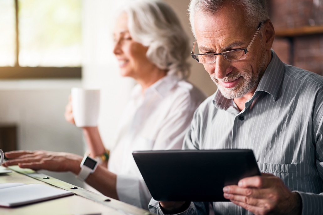 Man using tablet to learn about credit score