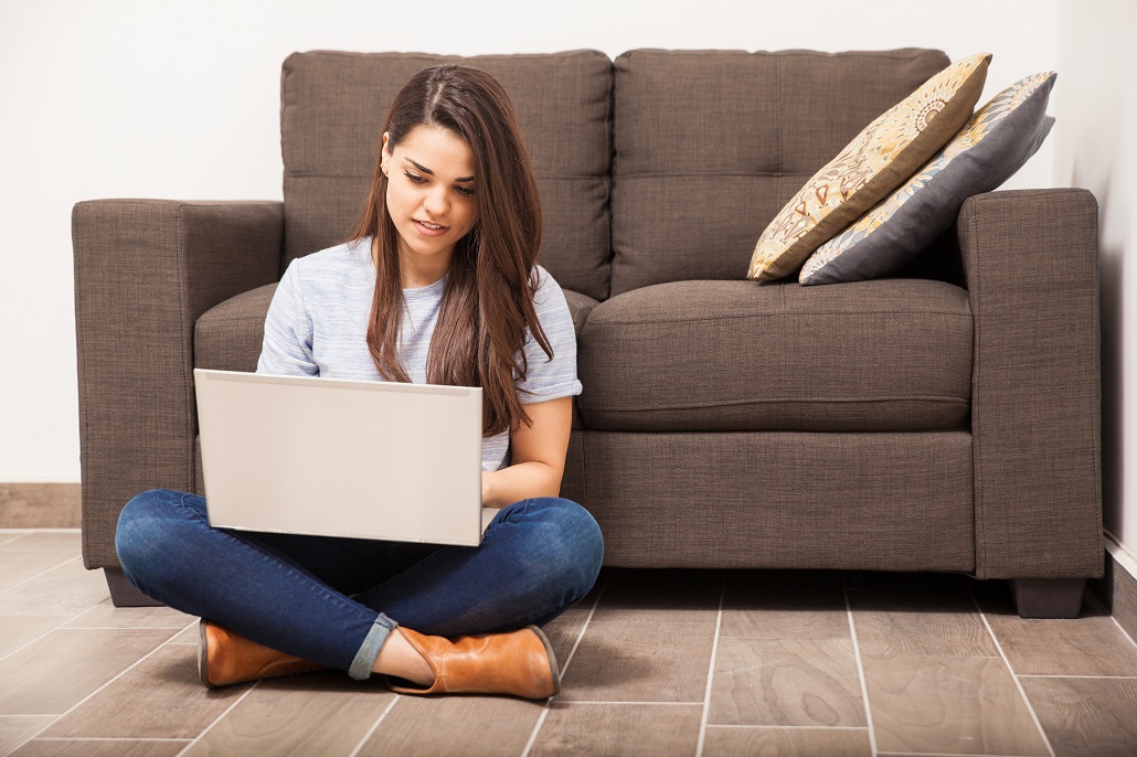 A student on a laptop applying for college