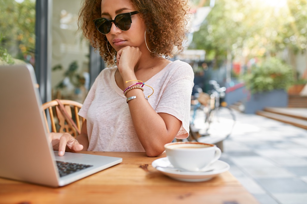 Woman using laptop to view Federal Student Aid Report 